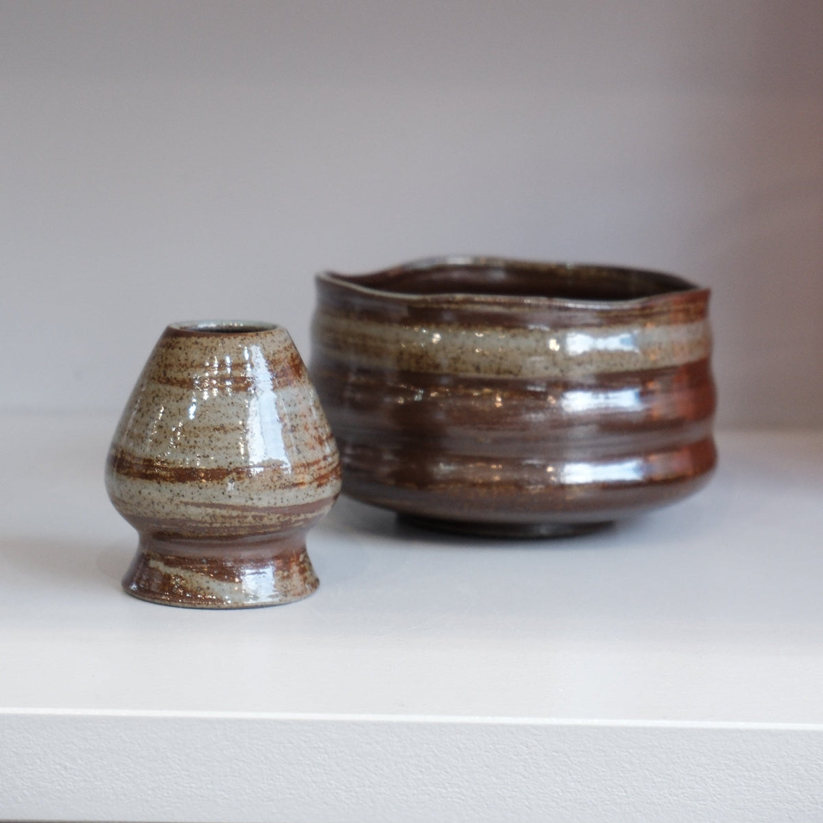 Handmade stoneware matcha bowl in Bark with a bamboo whisk