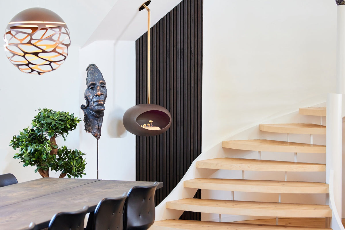 Le Feu Dome Sky ceiling-hung bioethanol fireplace suspended above the floor with real flames