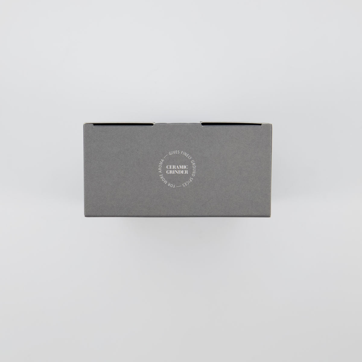 Top of the Nicolas Vahé Salt and Pepper gift box showing the Ceramic Grinder seal for finely ground spices and more aroma