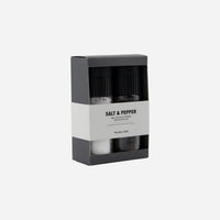 Salt and pepper shakers in a black and white packaging box on a white background