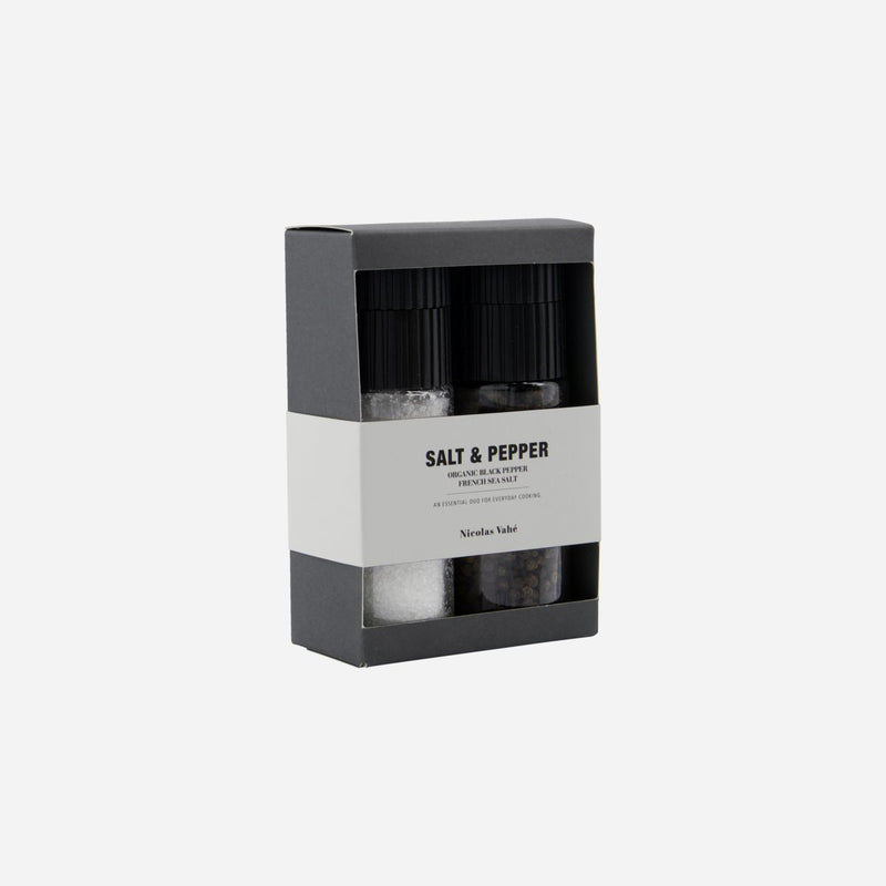 Salt and pepper shakers in a black and white packaging box on a white background
