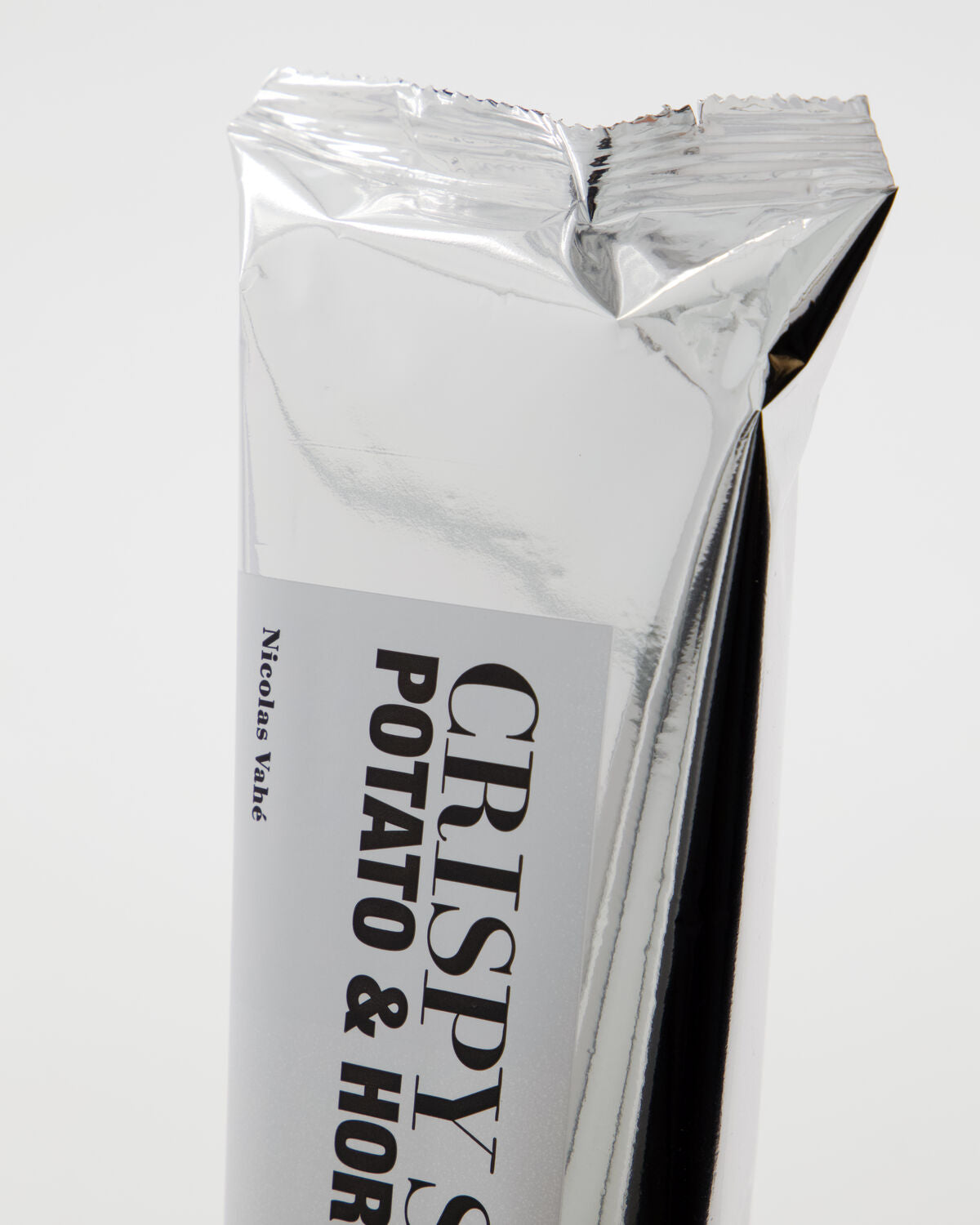 Close-up of the Nicolas Vahé potato and horseradish crispy snack packet