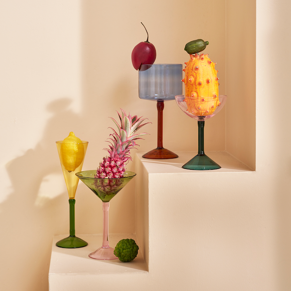 colourful cocktail glasses styled with fruit including pink coupe glass by Urban Nature Culture