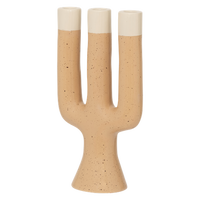 side view of sculptural Nox candle holder in soft natural tones