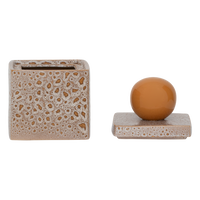 storage jar runa open showing textured ceramic surface and glossy orange lid handle