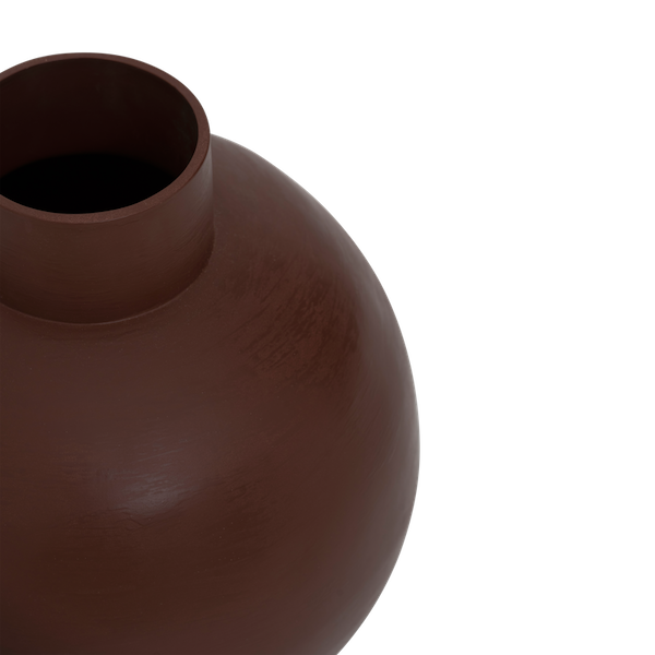 angled view of ilo red earthenware pot showing handmade rounded shape

