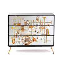 Artistic three-drawer chest with surreal trumpet imagery by Seletti
