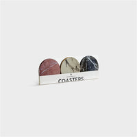 set of six marble-effect cork coasters in packaging