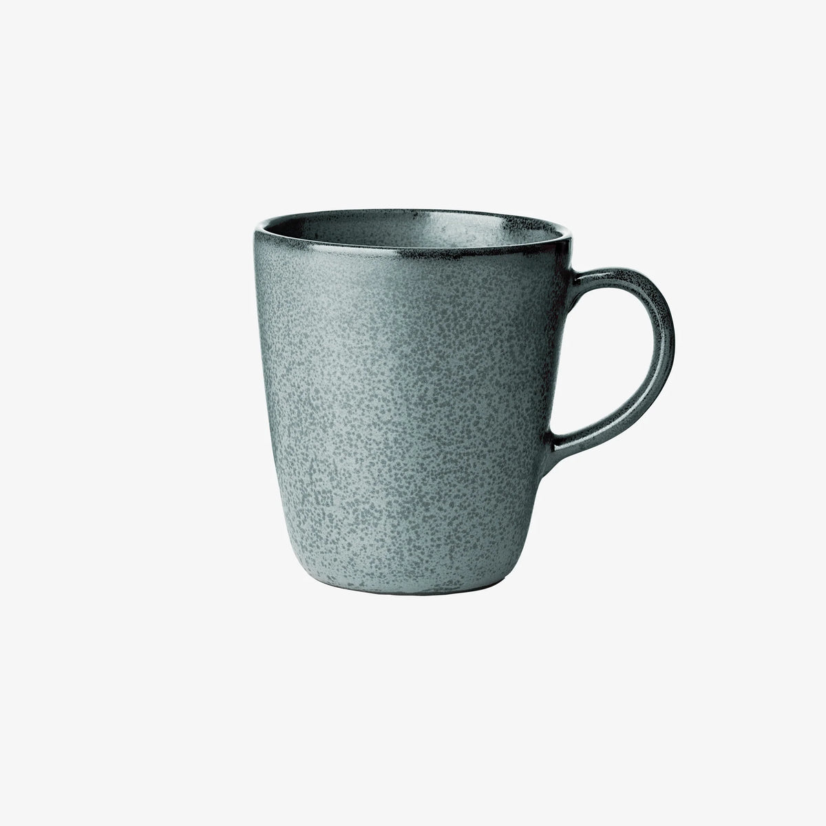 Speckled green stoneware mug adding warmth to slow morning routines