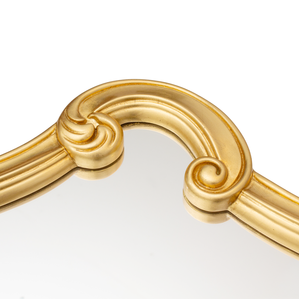 Close-up of a curved gold scroll on the Seletti Tetris Mirror 2.0 frame