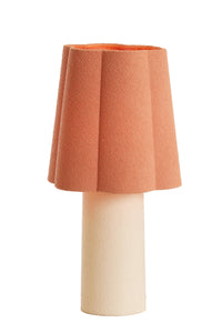 pink table lamp with textured fabric shade and sculptural round shape by Light & Living
