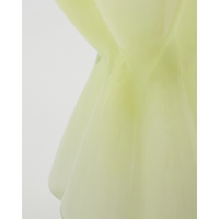 Close-up of the mouthblown soft lime glass and undulating curves of the House Doctor Say vase, showing handcrafted yellow green detail
