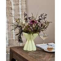 House Doctor Say vase in yellow green styled on a wooden coffee table with a seasonal bouquet of echinacea, ferns and dried grasses, a sculptural focal point for the living room