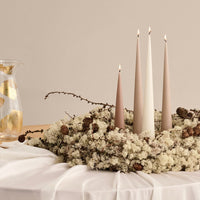 Cone candles in winter wreath table display