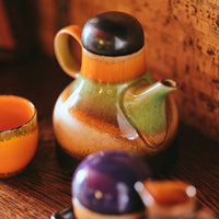 hkliving coffee jug with black lid and grass green round the middle and burnt orange and red in the lower bulbous with a thin spout