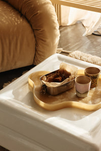 Small HKLIVING Patio tray holding chocolates and cups on a white ottoman beside a tan leather sofa