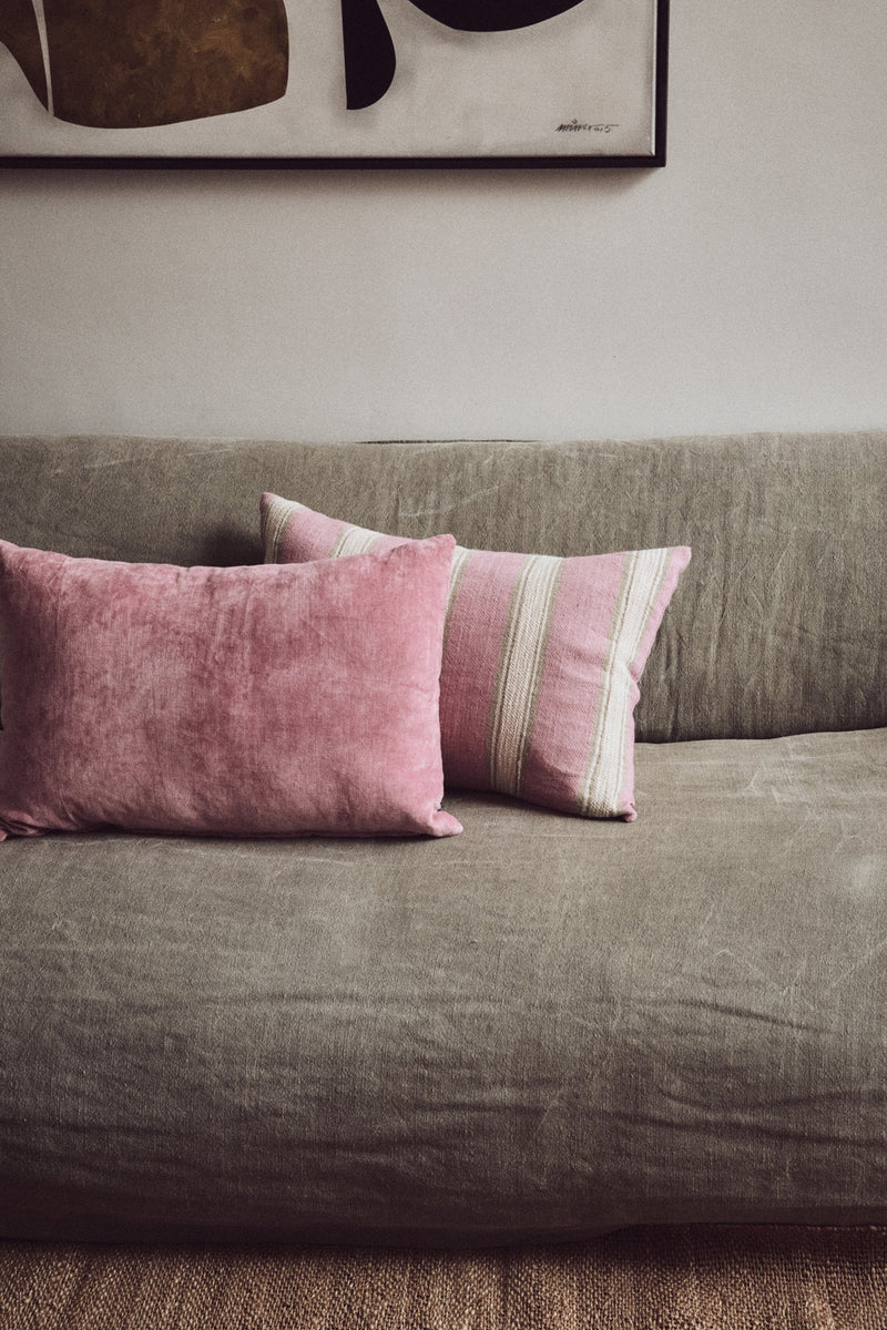 HKLIVING woven striped cushion in blush pink and cream, 60x40cm linen-cotton blend, styled on sofa
