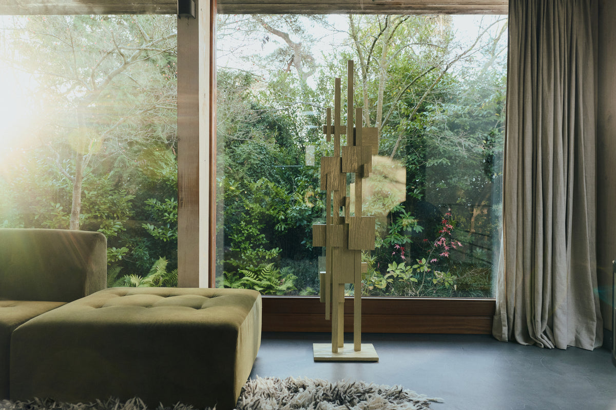 HKLIVING pistachio Skyscraper sculpture standing by a large window in a living room