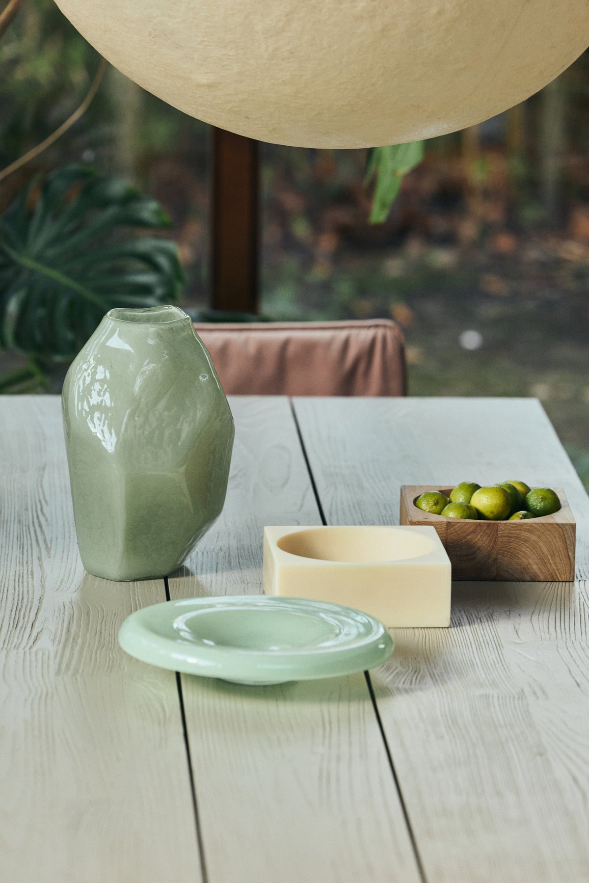 HKLIVING Pop Cube Large in Cream styled on a dining table with a ceramic vase, dish and bowl of limes