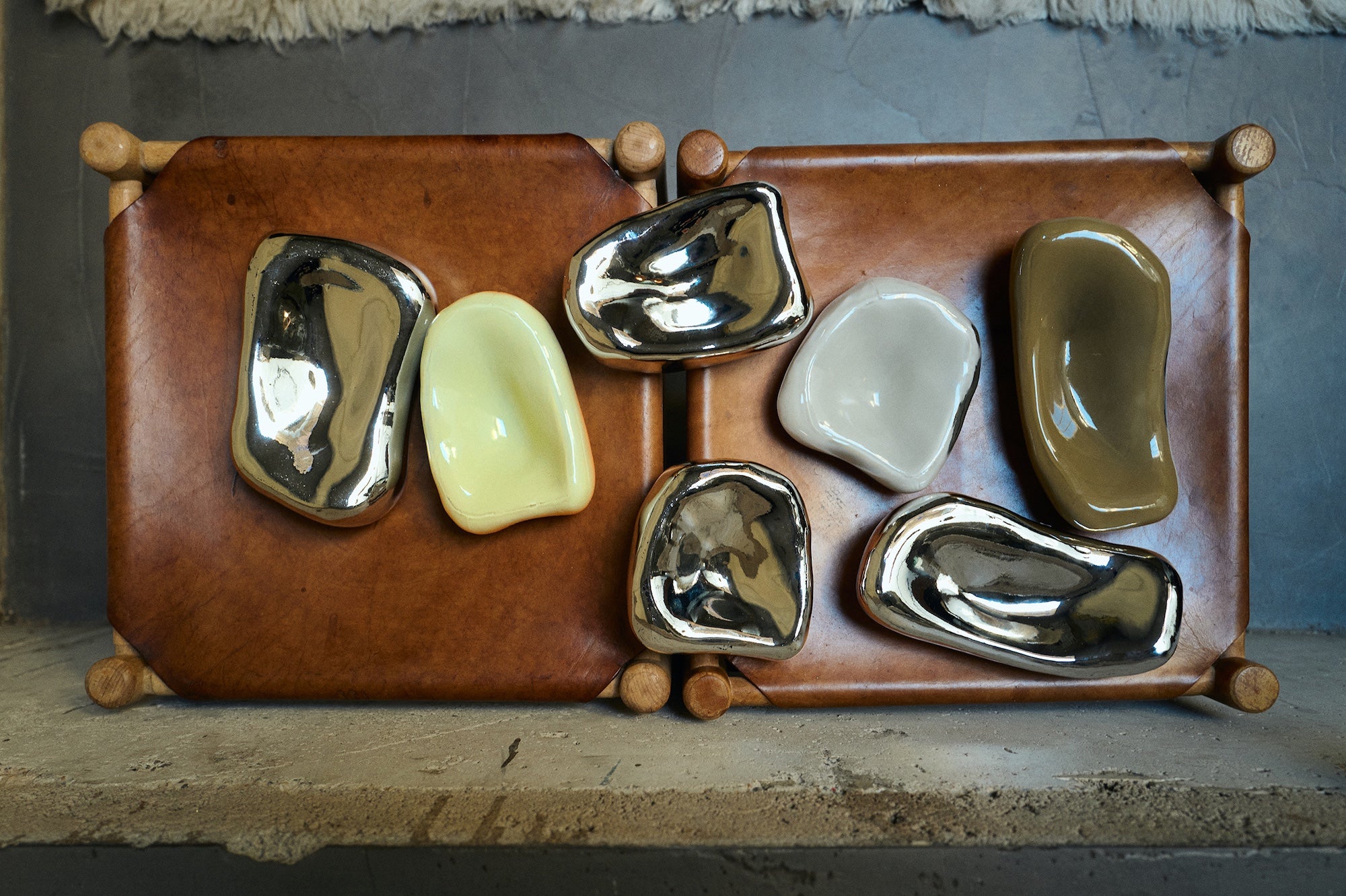 HKLIVING Glass Wall Sculpture collection including Cream, Moss, Overcast and Chrome colourways arranged on a leather tray