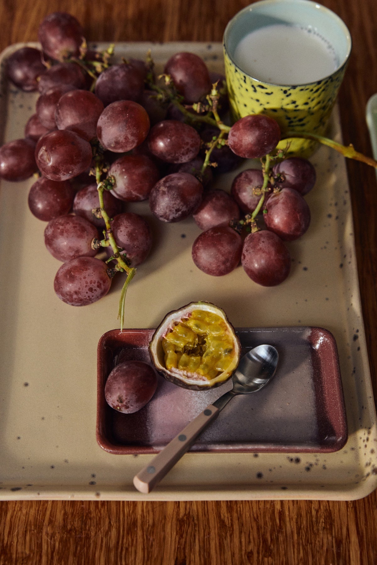 HKLIVING Bloom XS dish styled with passion fruit on a large ceramic tray for colourful serving