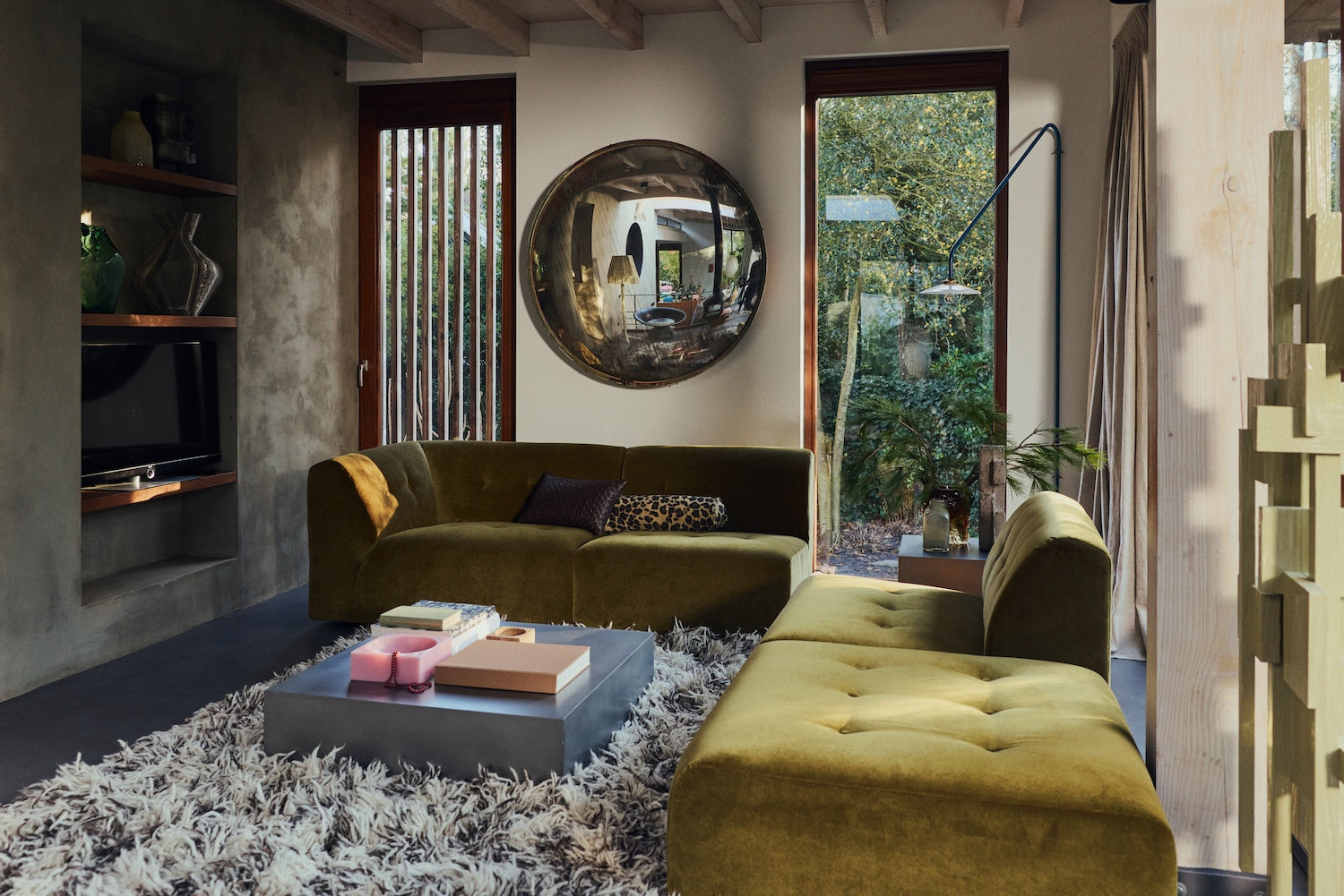 Chocolate brown woven cushion styled in a living room on an olive velvet sofa