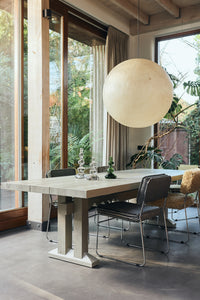 Nienke Sikkema glass candle holders styled in a Scandinavian dining room setting