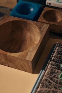 Close-up of HKLIVING teak cube bowls in different sizes alongside a teal resin trinket dish on a wooden surface