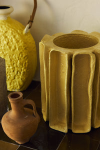 Yellow Sculptural Vase styled on a console table