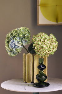 Small yellow Sculptural Vase by HKLIVING in a styled interior