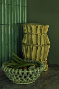 Ribbed cotton maché vase in yellow, lifestyle shot