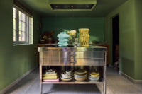Large yellow Sculptural Vase styled interior detail
