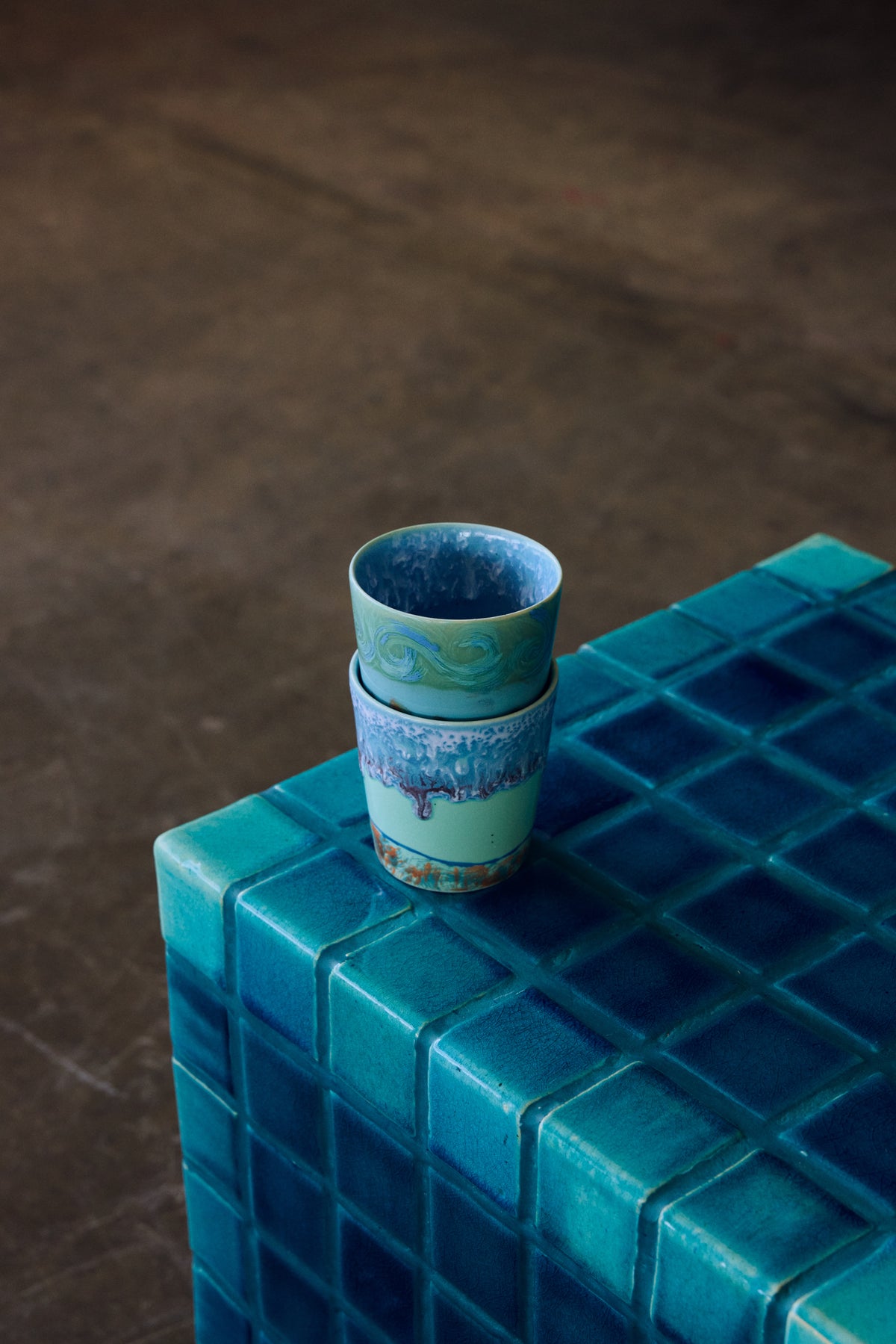 Tiled Side Table in Turquoise by HKLIVING – styled in a living room setting