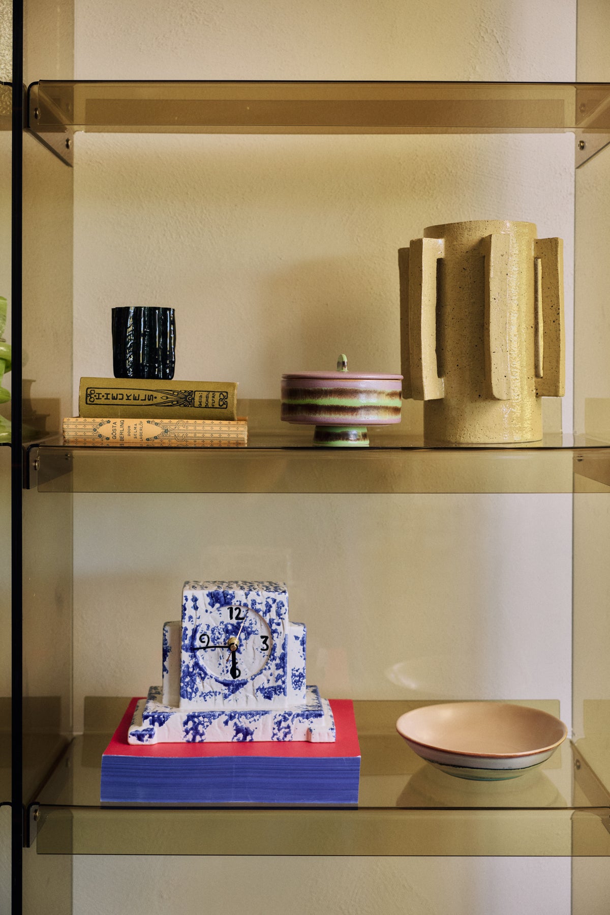 70s Ceramics curry bowl in Muted styled on an open glass shelf alongside other 70s ceramics decor pieces