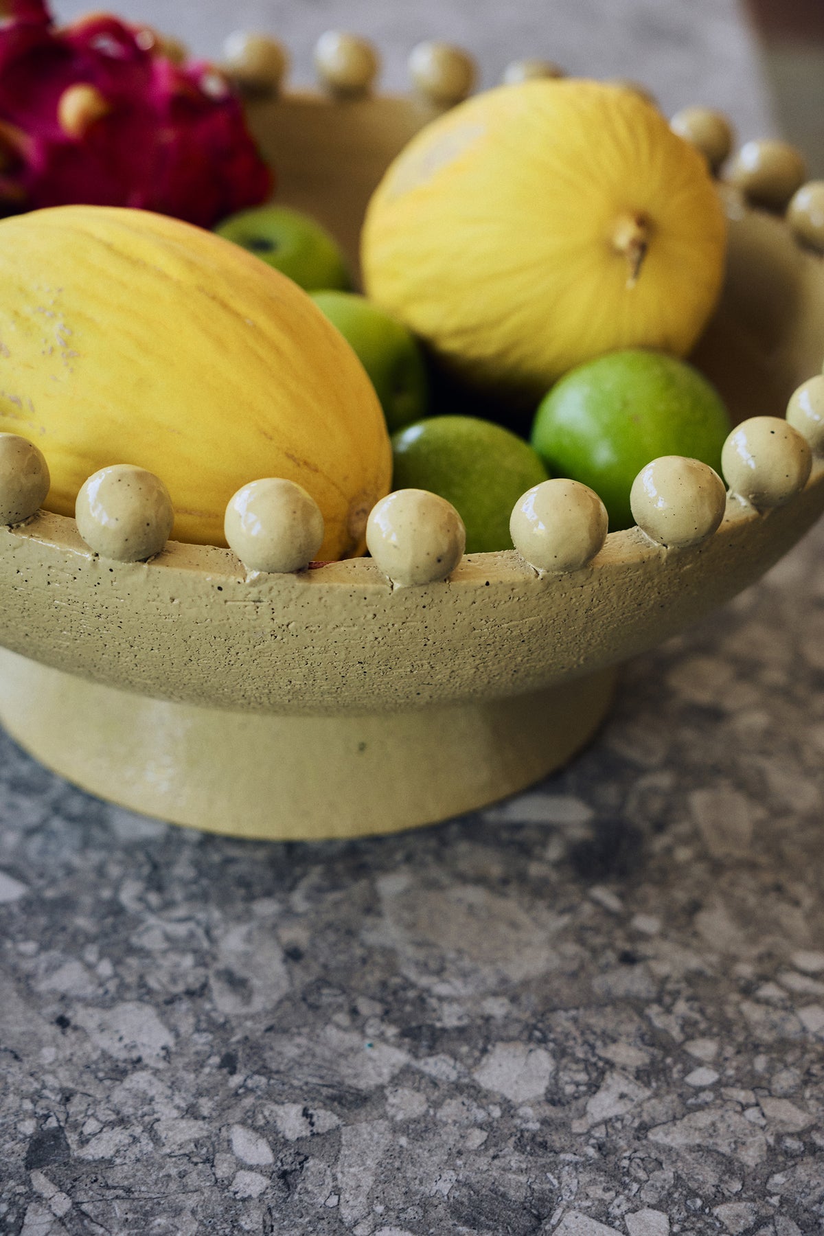 Robust Ceramic Bowl in Mustard by HKLIVING – styled in a living room setting