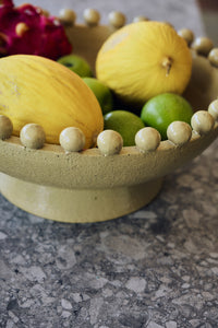 Robust Ceramic Bowl in Mustard by HKLIVING – styled in a living room setting