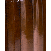 Close-up texture of brown ribbed planter showing gloss and depth