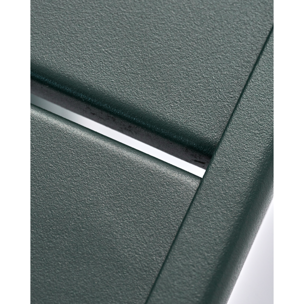 Close-up of dark green iron coffee table surface