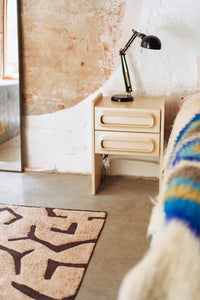 Lifestyle shot of the cream Space Nightstand by HKLIVING styled in a room setting