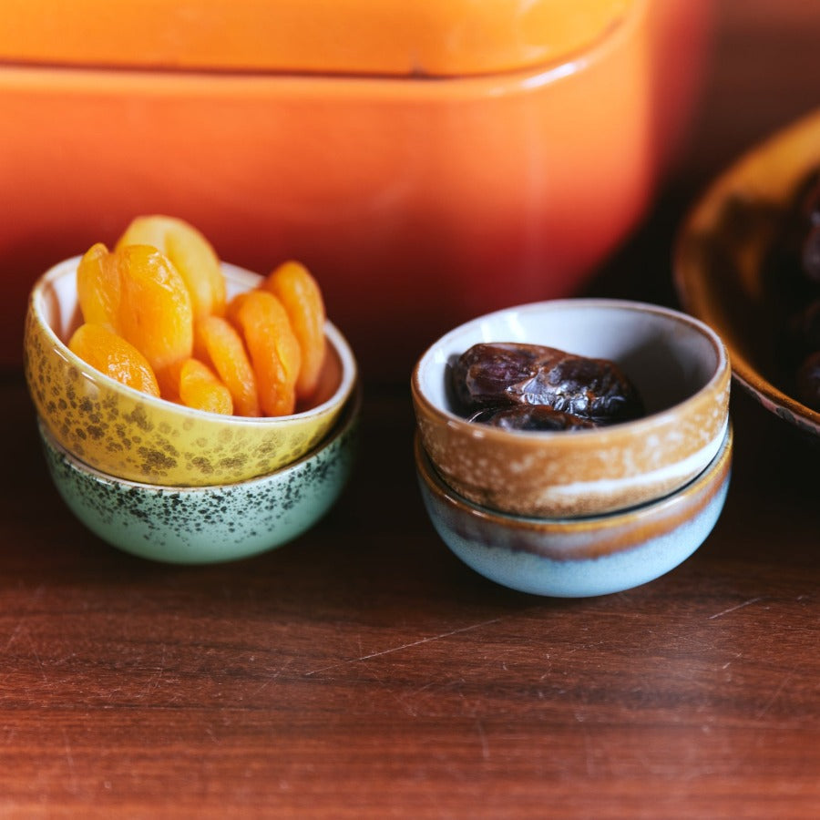 hkliving XS bowls filled with dried apricots and dates, styled on a wooden counter next to an orange canister