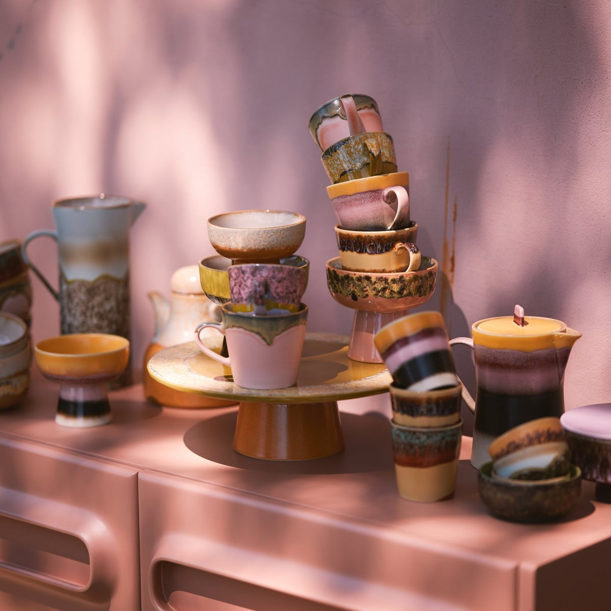 HKLIVING 70s ceramics cappuccino mugs stacked on a pink cabinet