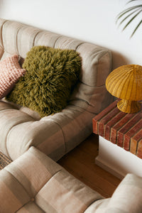 Olive green fluffy wool cushion 50x50cm, square scatter cushion angled view by HKLIVING

