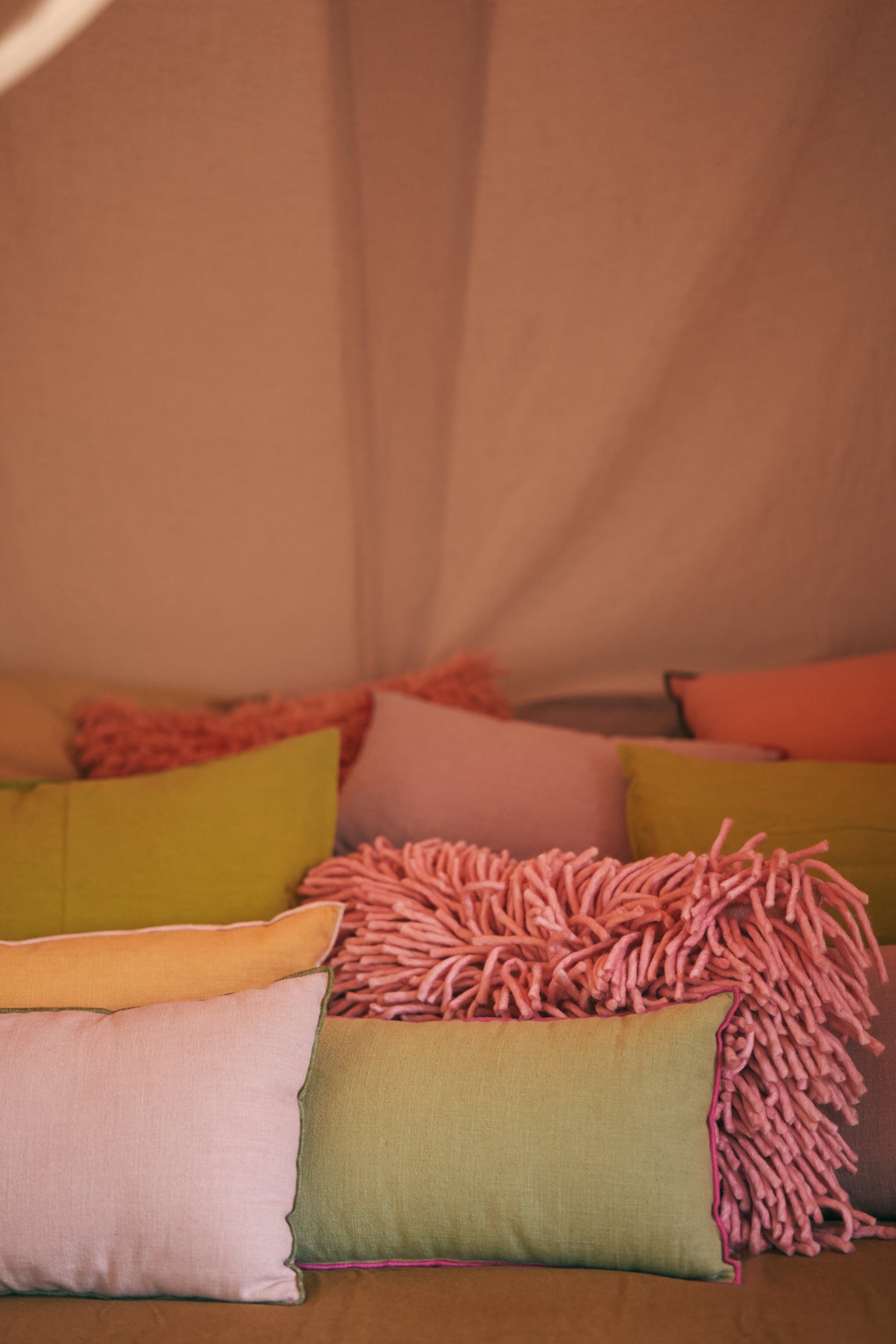 Pink rugged wool cushion by HKLIVING, styled in living room with soft pink texture detail
