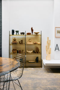 Lifestyle shot of the Olive Green Acrylic Cabinet by HKLIVING in a showroom setting