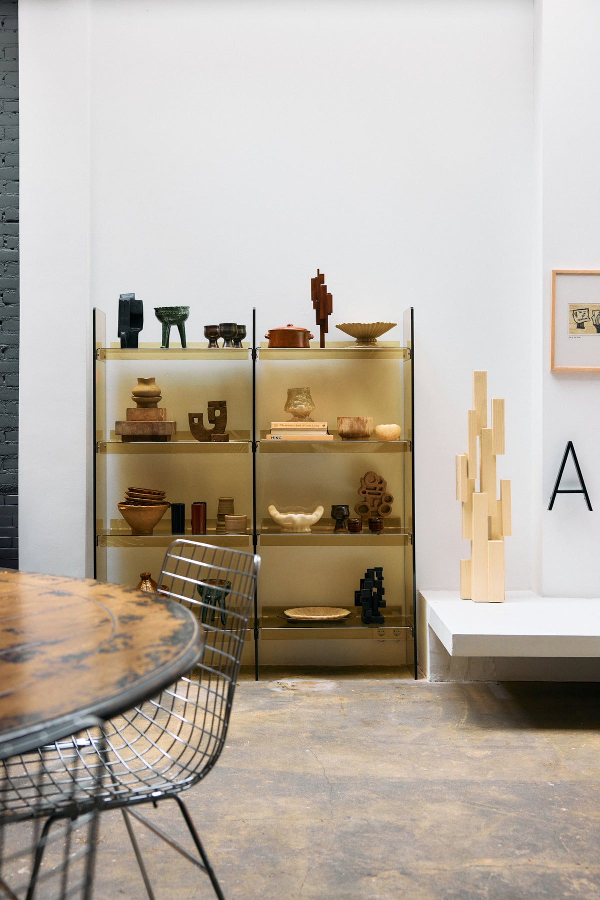 Lifestyle shot of the Olive Green Acrylic Cabinet by HKLIVING in a showroom setting