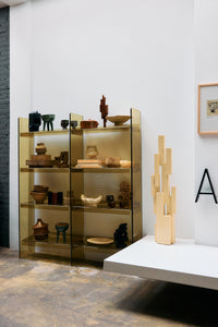 Lifestyle shot of the Olive Green Acrylic Cabinet by HKLIVING in a showroom setting