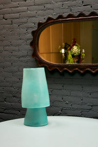 HKLIVING wooden ripple mirror hung on an exposed brick wall, reflecting a dried flower arrangement