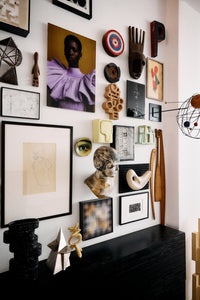 Wider view of the HKLIVING Pocket Exhibit 'Dwell' hung among a curated gallery wall of art and objects