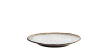stoneware dinner plate side view showing shallow profile and rim
