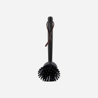 Meraki bamboo dish brush in black with leather hanging strap and replaceable brush head, a stylish sustainable swap for the kitchen sink